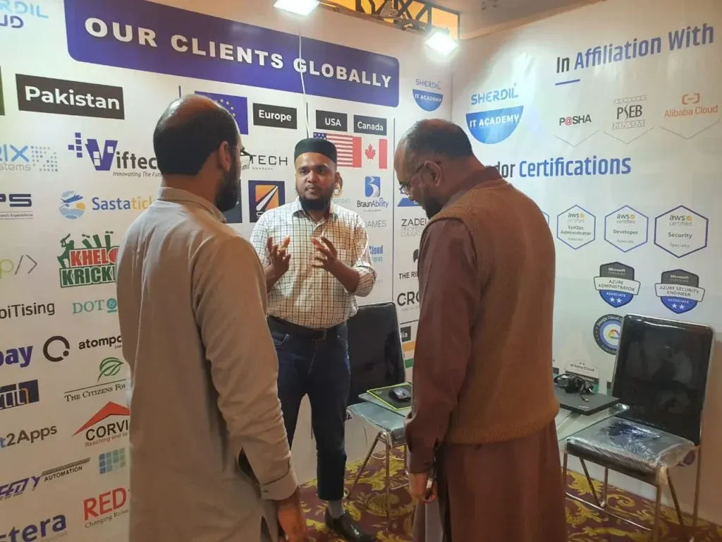 Sherdil team member explaining services to visitors, ITCN Asia 2023