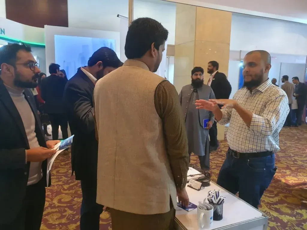 Visitors in discussion with the Sherdil team, ITCN Asia 2023