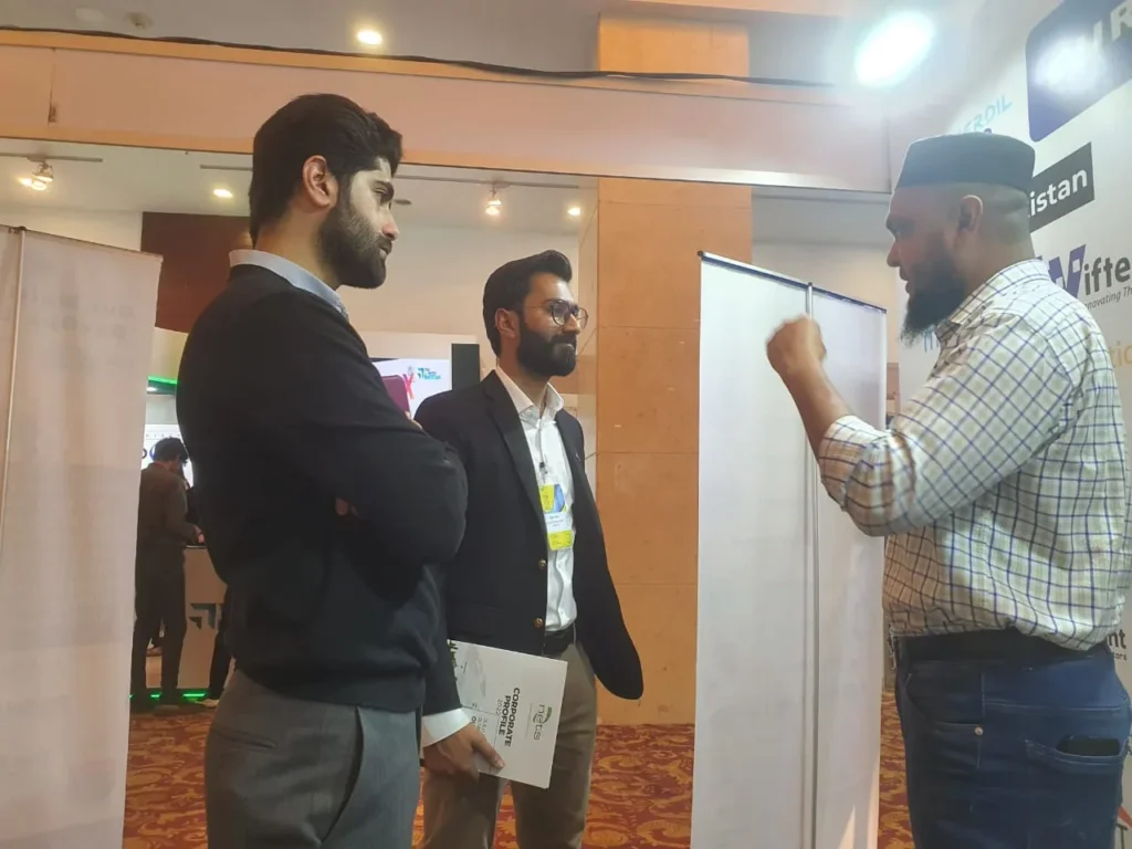 Sherdil representative talking with a visitor, ITCN Asia 2023