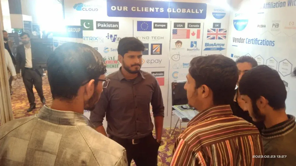 Students talking with the Sherdil team at the Our Clients Globally wall, ITCN Asia 2023