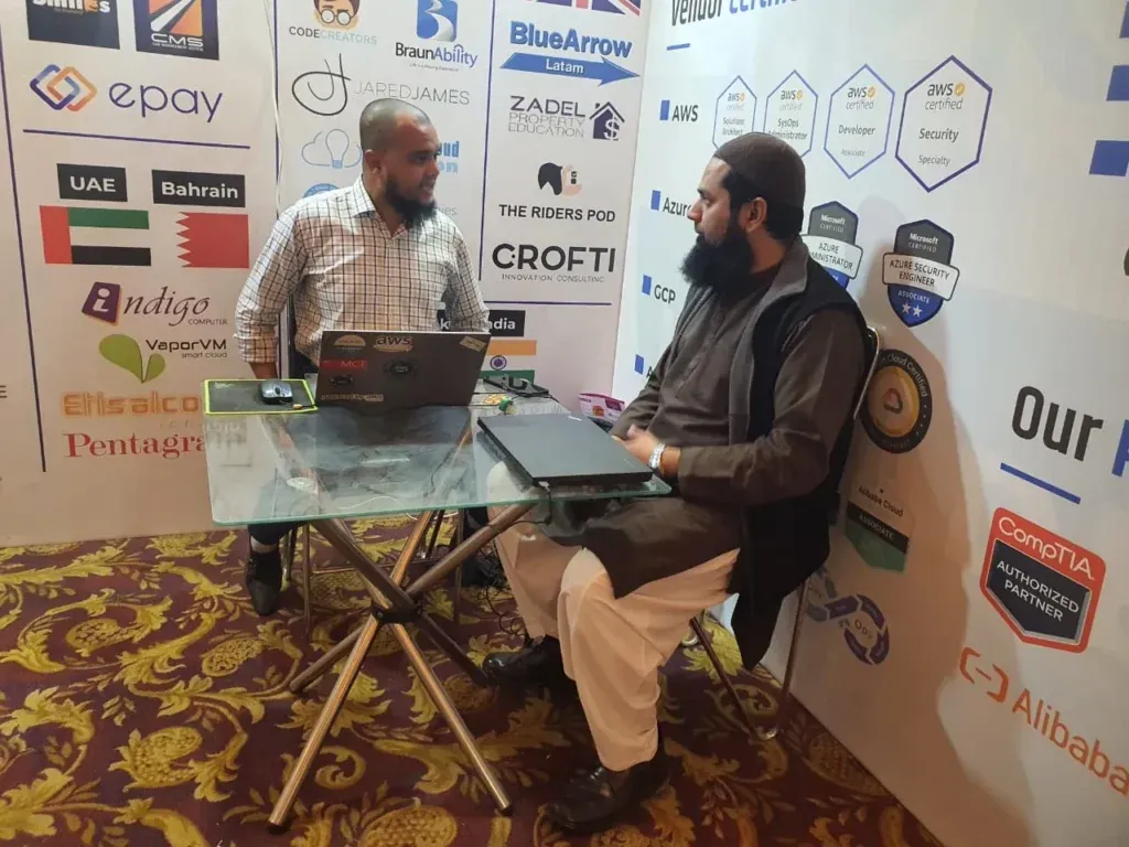 Meeting at the Sherdil booth desk, ITCN Asia 2023