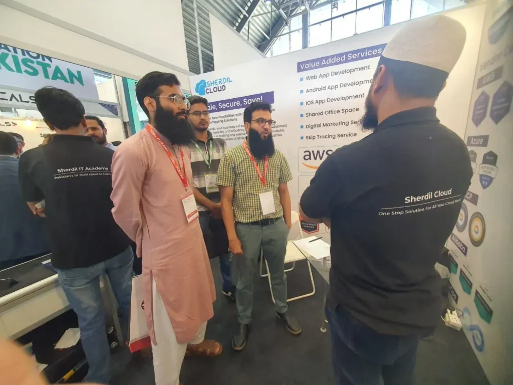 Sherdil team member talking with visitors at the booth, ITCN Asia 2024 Lahore