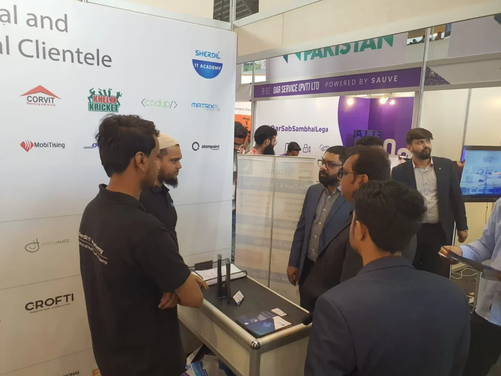 Sherdil team member presenting to visitors at the client wall, ITCN Asia 2024 Lahore