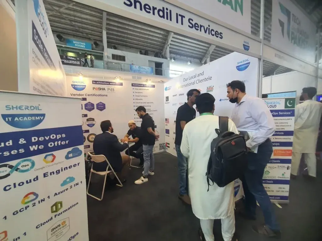 Sherdil IT Services booth with cloud and DevOps course banners, ITCN Asia 2024 Lahore