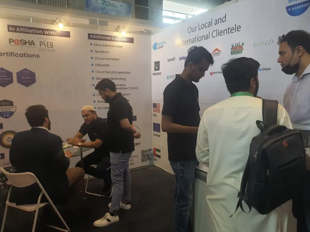 Visitors talking with the Sherdil team at the booth, ITCN Asia 2024 Lahore