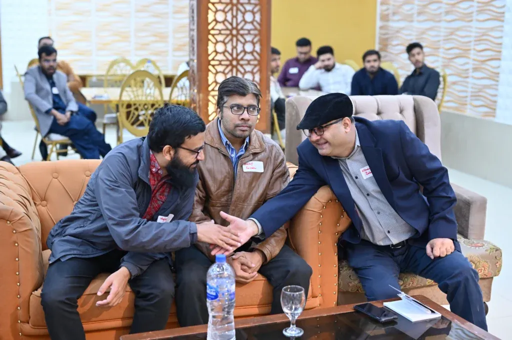 Guests shaking hands on a sofa, Sherdil Annual Students Meetup 2024
