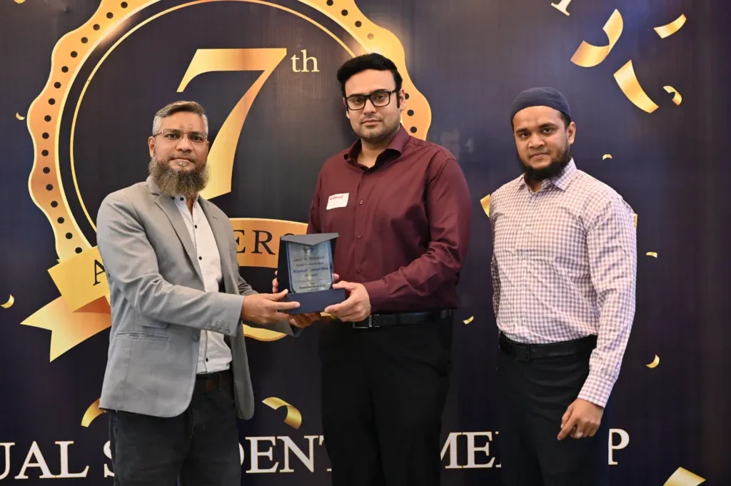 Student receiving an award at the Sherdil 7th Anniversary Meetup 2024