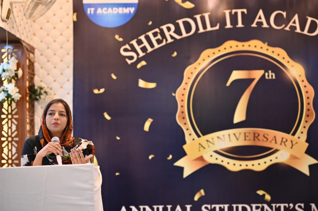 Speaker addressing guests at the Sherdil IT Academy 7th Anniversary Meetup 2024