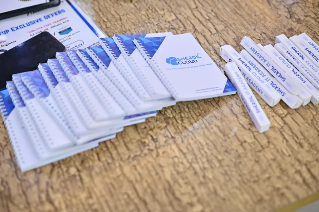 Sherdil Cloud brochures and pens on a table, 7th Anniversary Meetup 2024