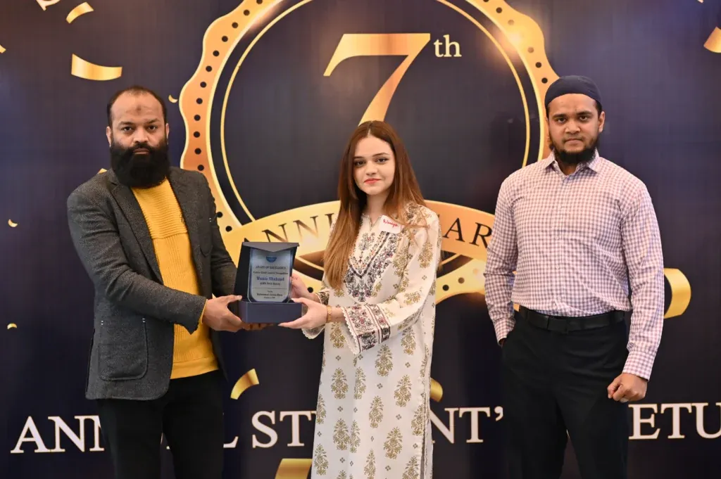 Female graduate receiving an award at the Sherdil 7th Anniversary Meetup 2024