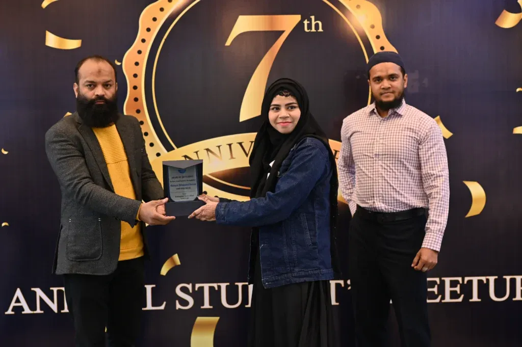 Female student receiving an award at the Sherdil 7th anniversary, 2024