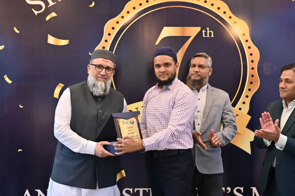 Recognition shield presented on stage, Sherdil Annual Students Meetup 2024
