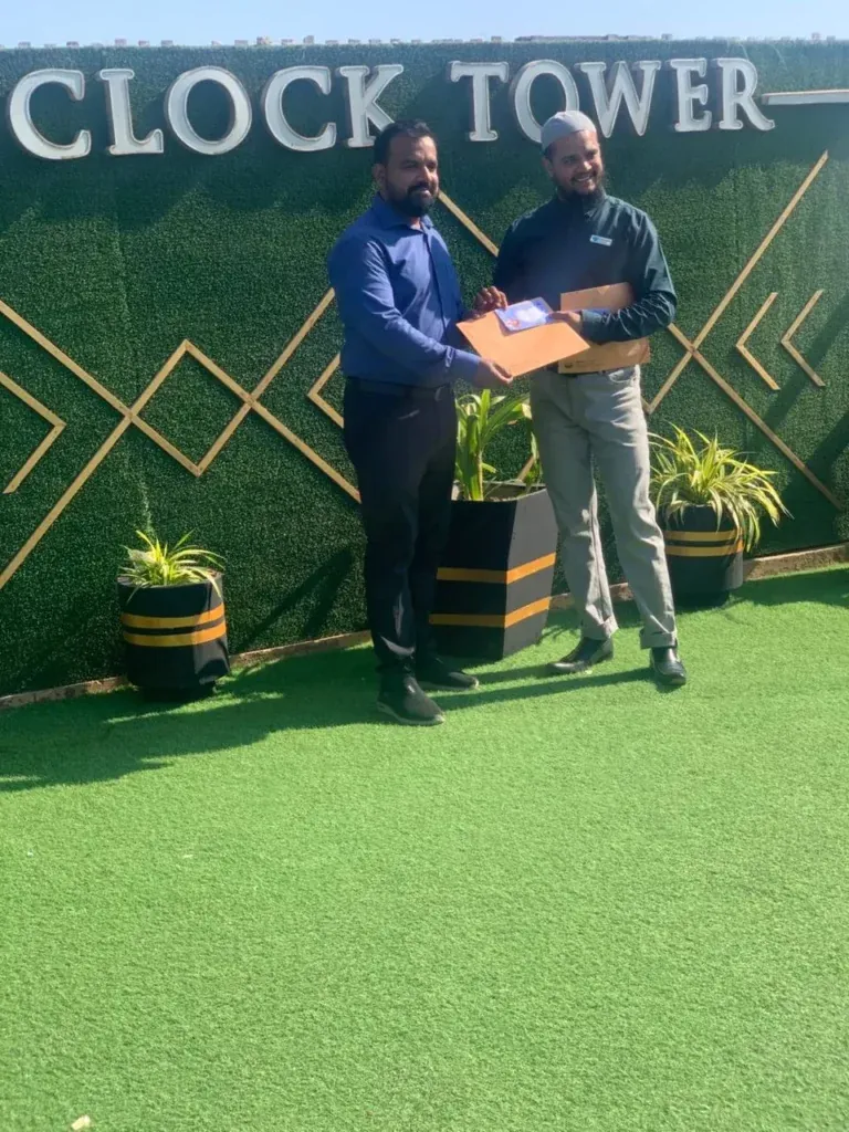 Award handover at the Sherdil Annual Lunch 2024 on the Clock Tower rooftop