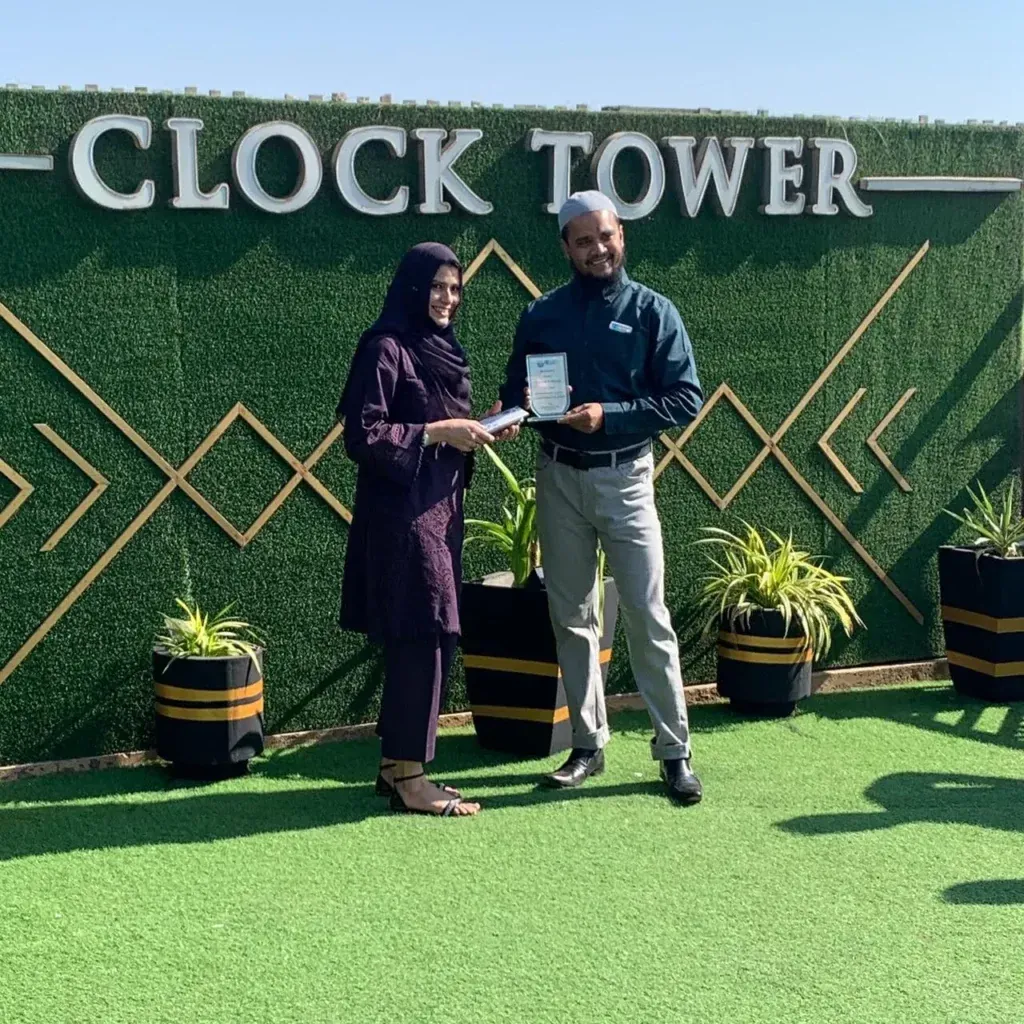 Female team member receiving an award at the Sherdil Annual Lunch 2024