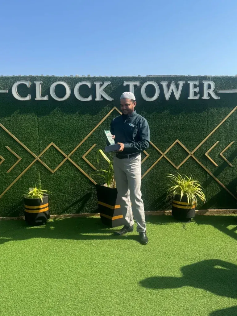 Award recipient posing on the Clock Tower rooftop, Sherdil Annual Lunch 2024