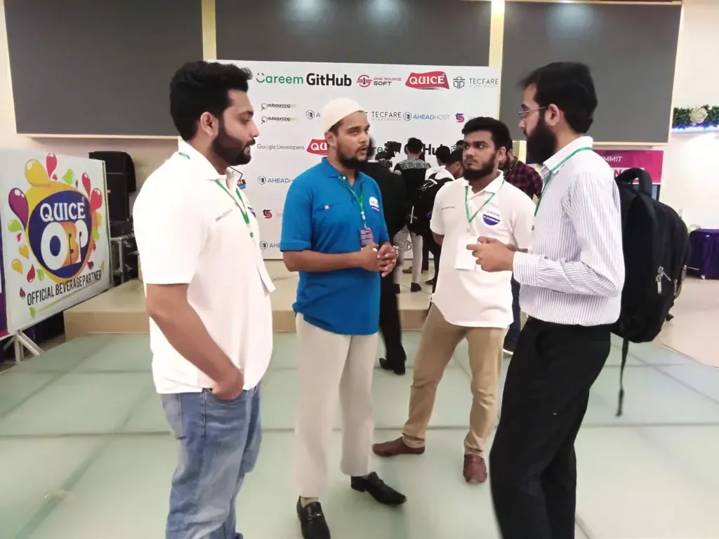 Sherdil team members talking at a tech event, July 2019