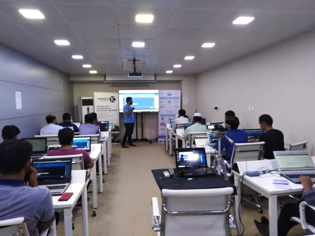 Participants working on laptops during the AWS session at 10Pearls, 2019