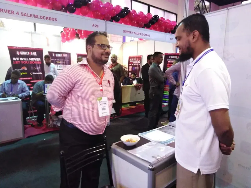 Sherdil team member talking with a visitor, ITCN Asia 2019
