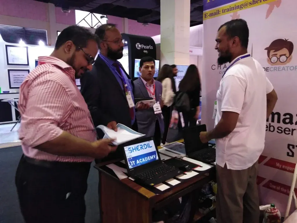 Visitor reviewing details at the Sherdil desk, ITCN Asia 2019