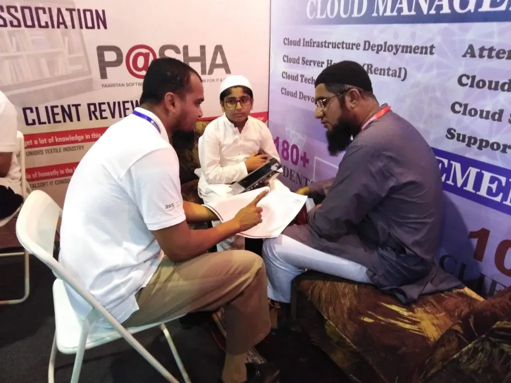 Meeting at the Sherdil stall beside the P@SHA association banner, ITCN Asia 2019