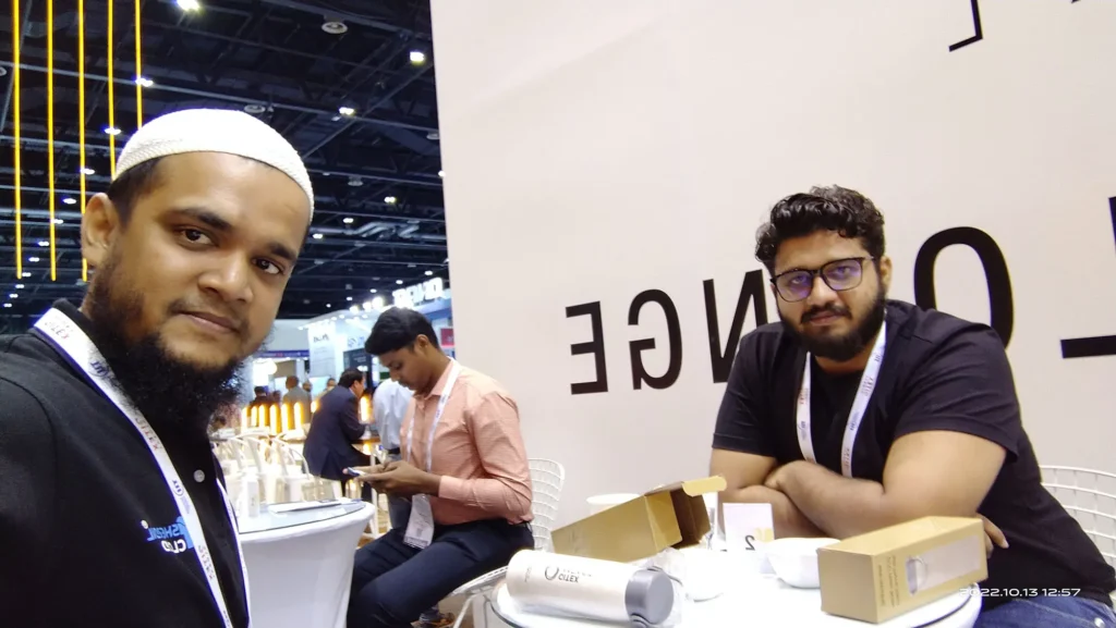 Sherdil team member taking a selfie with a colleague, GITEX Dubai 2022