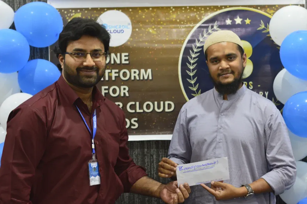 Team member receiving an envelope at the Sherdil Annual Dinner 2022