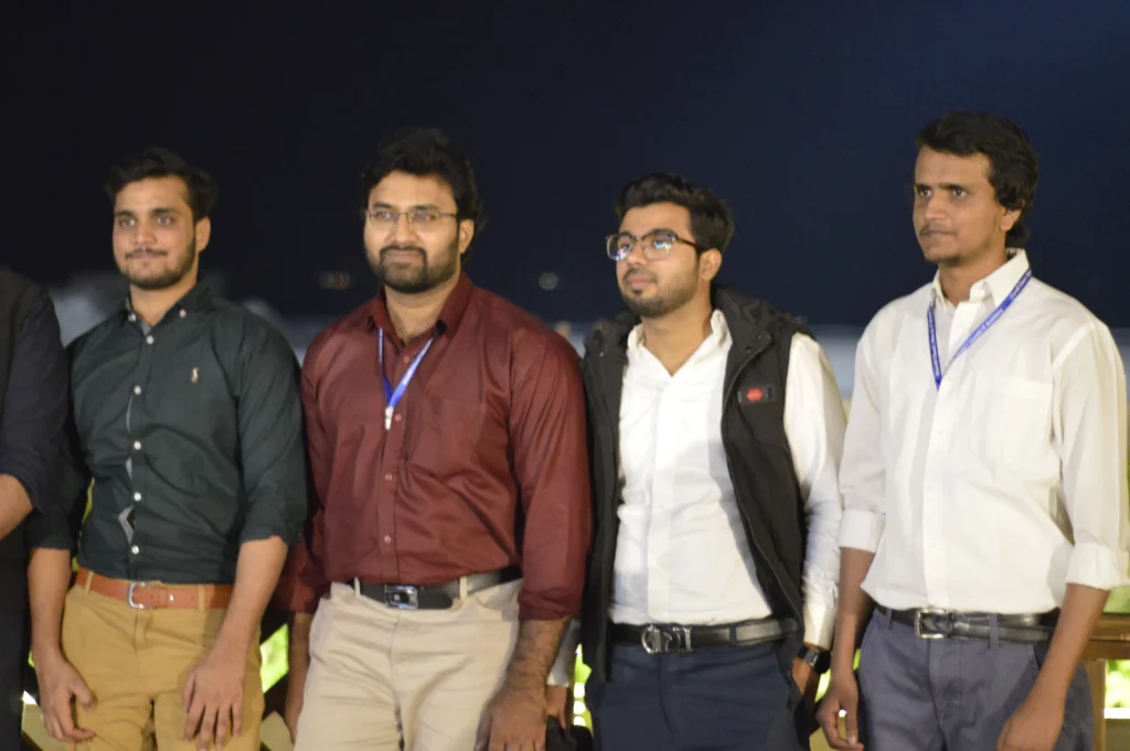 Four team members posing at the Sherdil Annual Dinner 2022