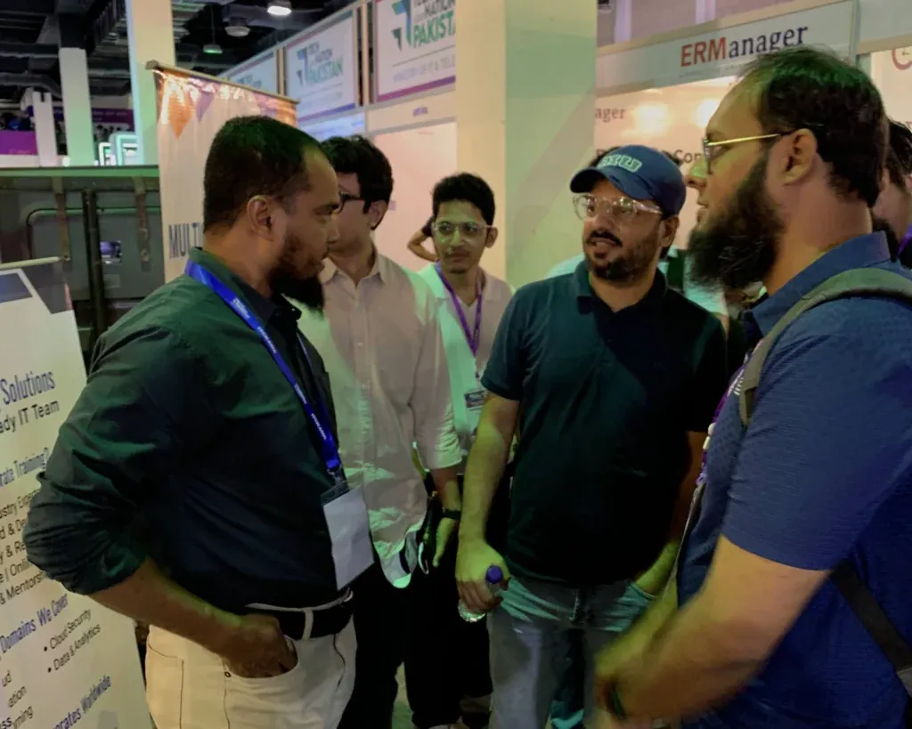 Visitors in conversation at the Sherdil booth, ITCN Asia 2025 Karachi