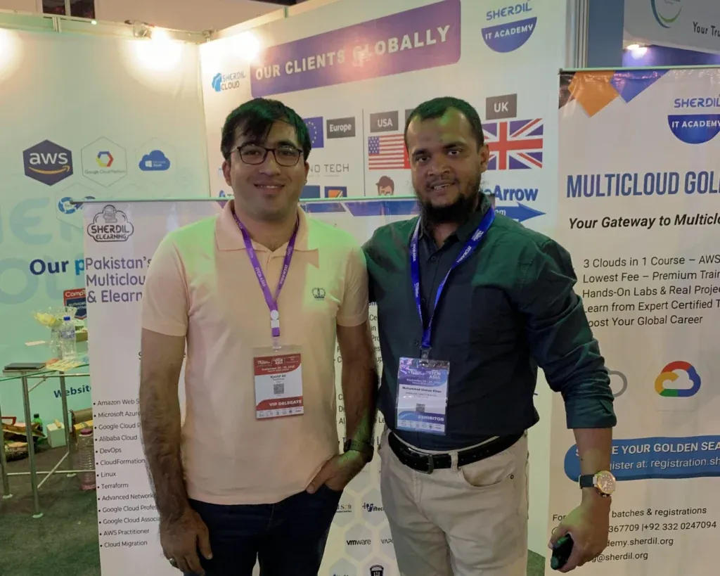 Two visitors posing at the Sherdil multicloud booth, ITCN Asia 2025