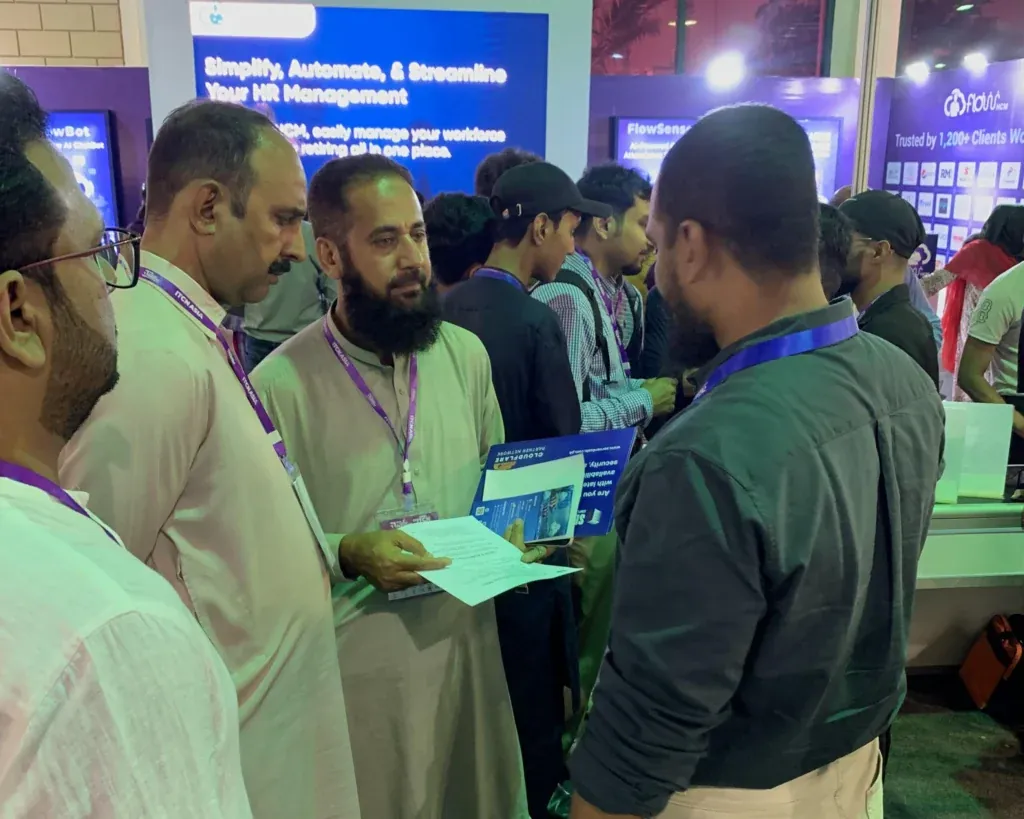 Visitors reading brochures at the Sherdil booth, ITCN Asia 2025