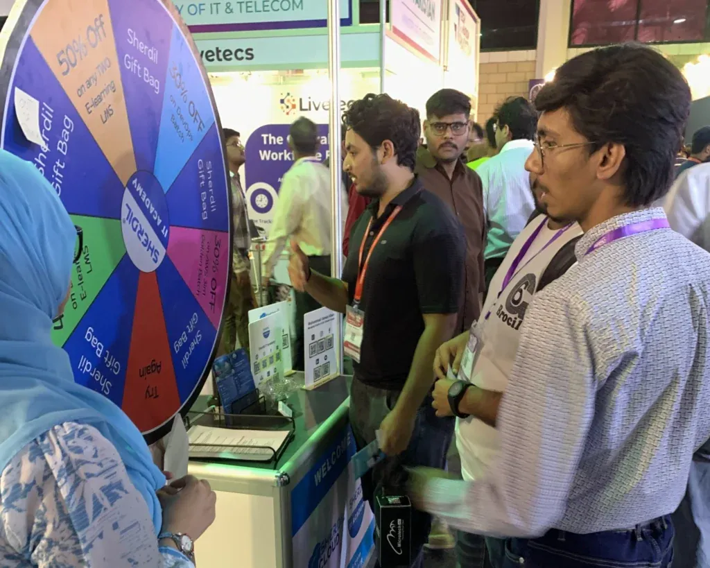 Students gathered at the Sherdil prize wheel, ITCN Asia 2025 Karachi