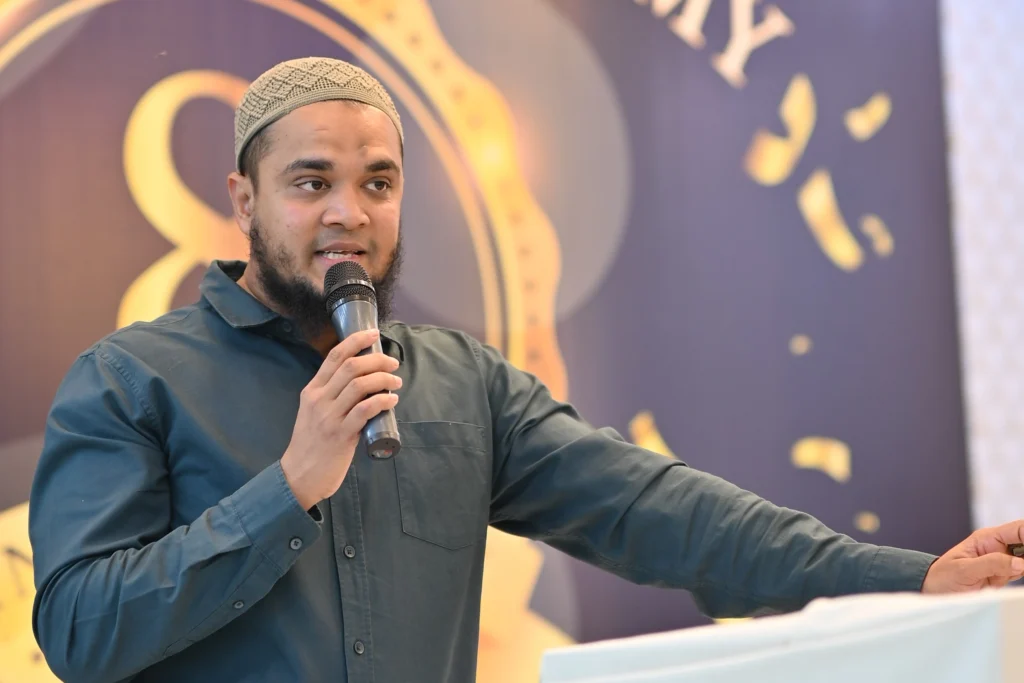 Speaker with a microphone at the Sherdil Annual Students Meetup 2025