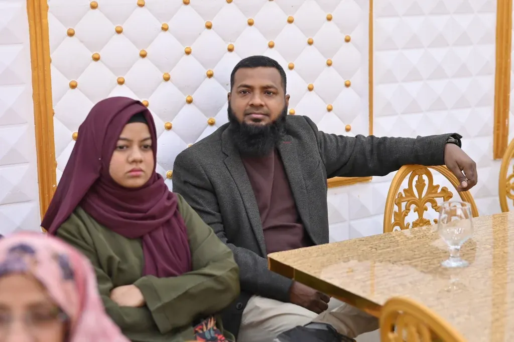 Attendees seated at a table during the Sherdil 8th anniversary meetup, 2025