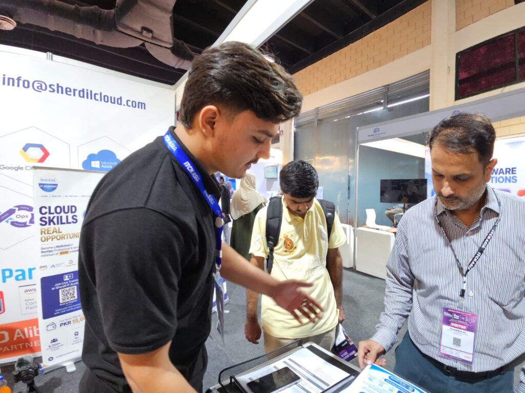 Sherdil team member explaining cloud courses to visitors, ITCN Asia 2026