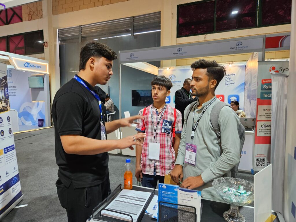 Sherdil team member speaking with students at the booth, ITCN Asia 2026