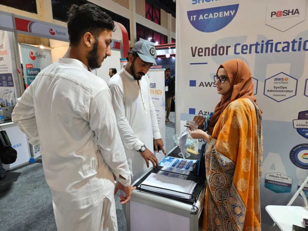 Visitors discussing courses at the Sherdil vendor certification stand, ITCN Asia 2026