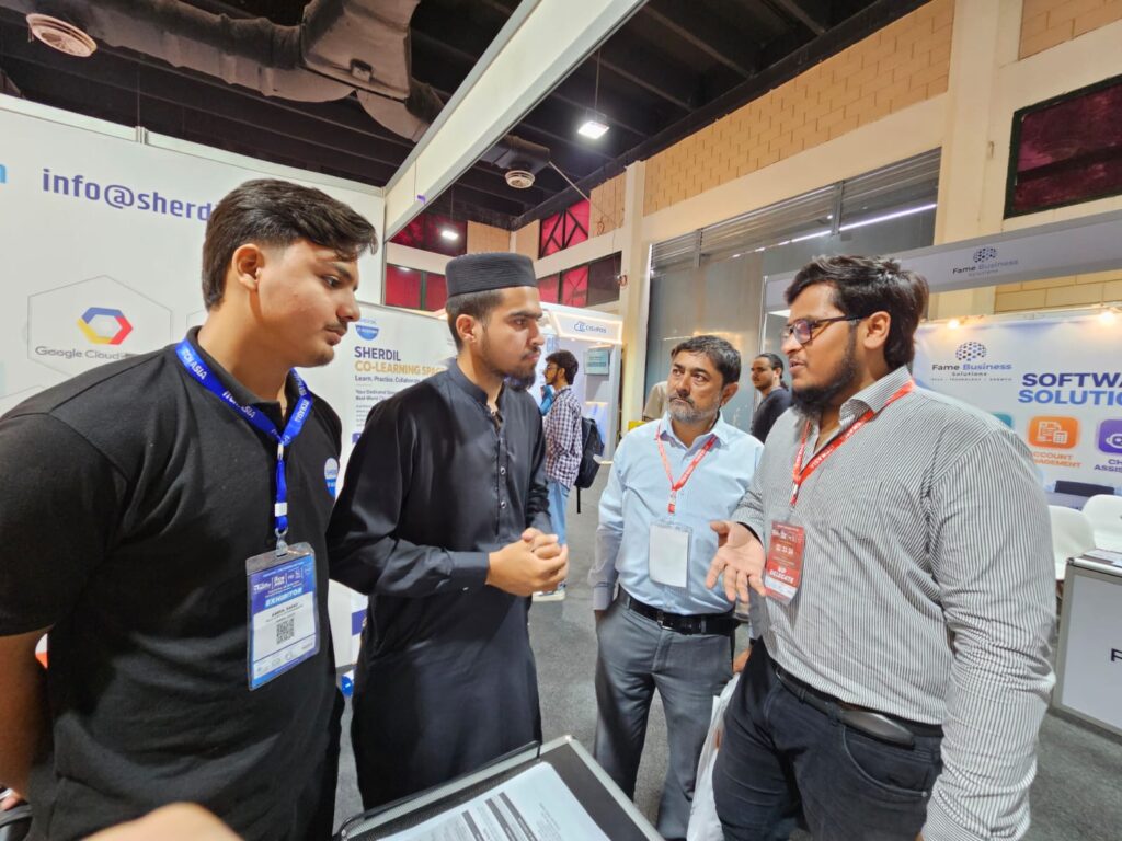 Group conversation at the Sherdil Cloud booth, ITCN Asia 2026 Karachi