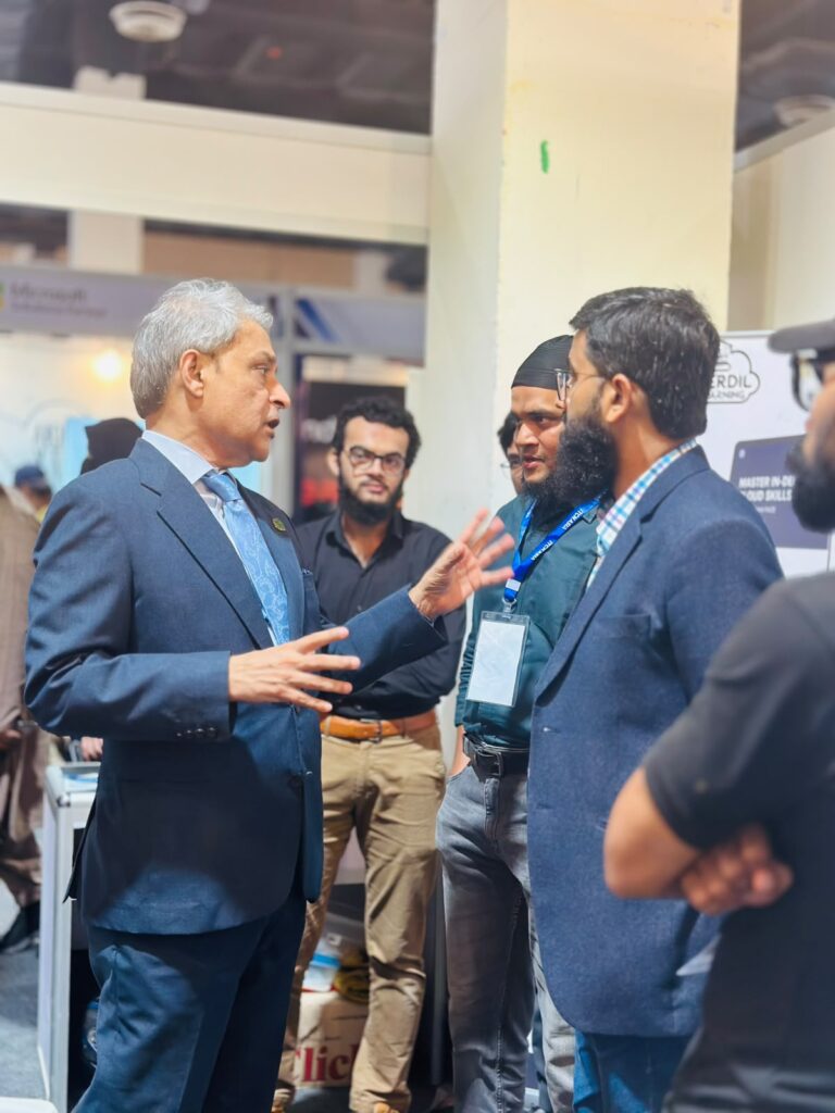 Guests in conversation near the Sherdil stand, ITCN Asia 2026 Karachi