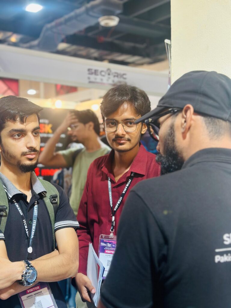 Students talking with a Sherdil team member, ITCN Asia 2026